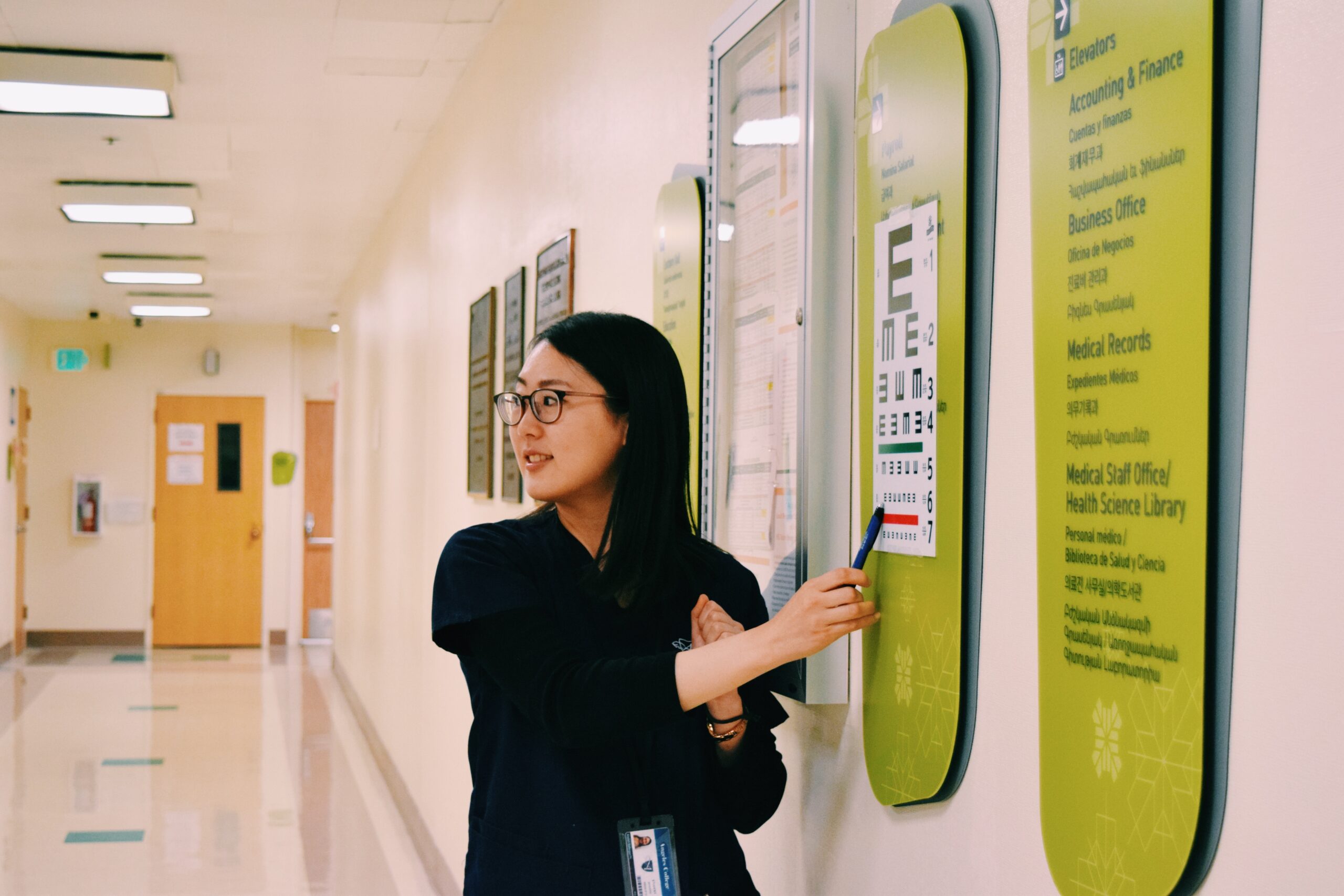 Student pointing at an eye vision chart